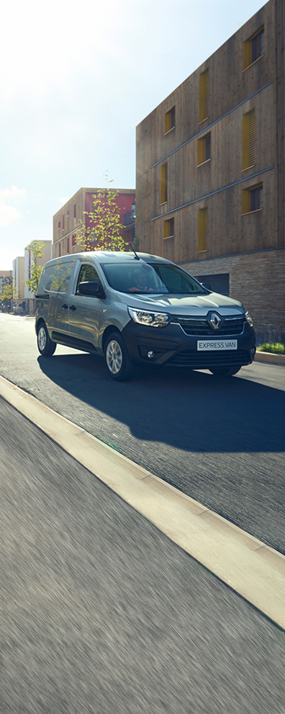 Renault Express Van driving down a road front view