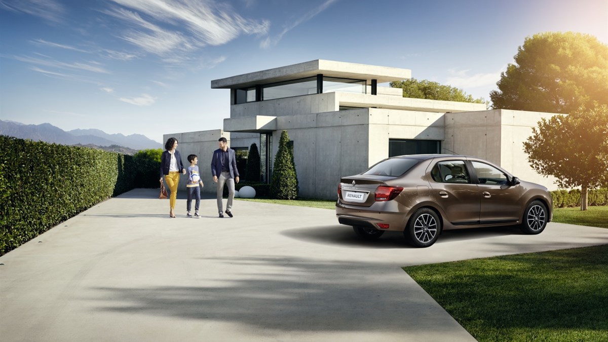 A Family Standing Along Renault Symbol