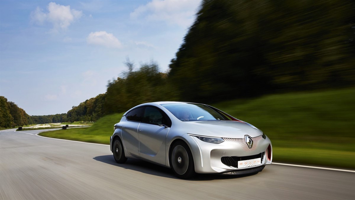 A Renault car driving down a road
